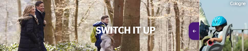 Still image from Heathrow banner ad showing a family walking in woods on holiday